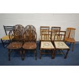 A SET OF FOUR STAINED BEECH WHEELBACK CHAIRS, along with a set of four oak chairs, and two other