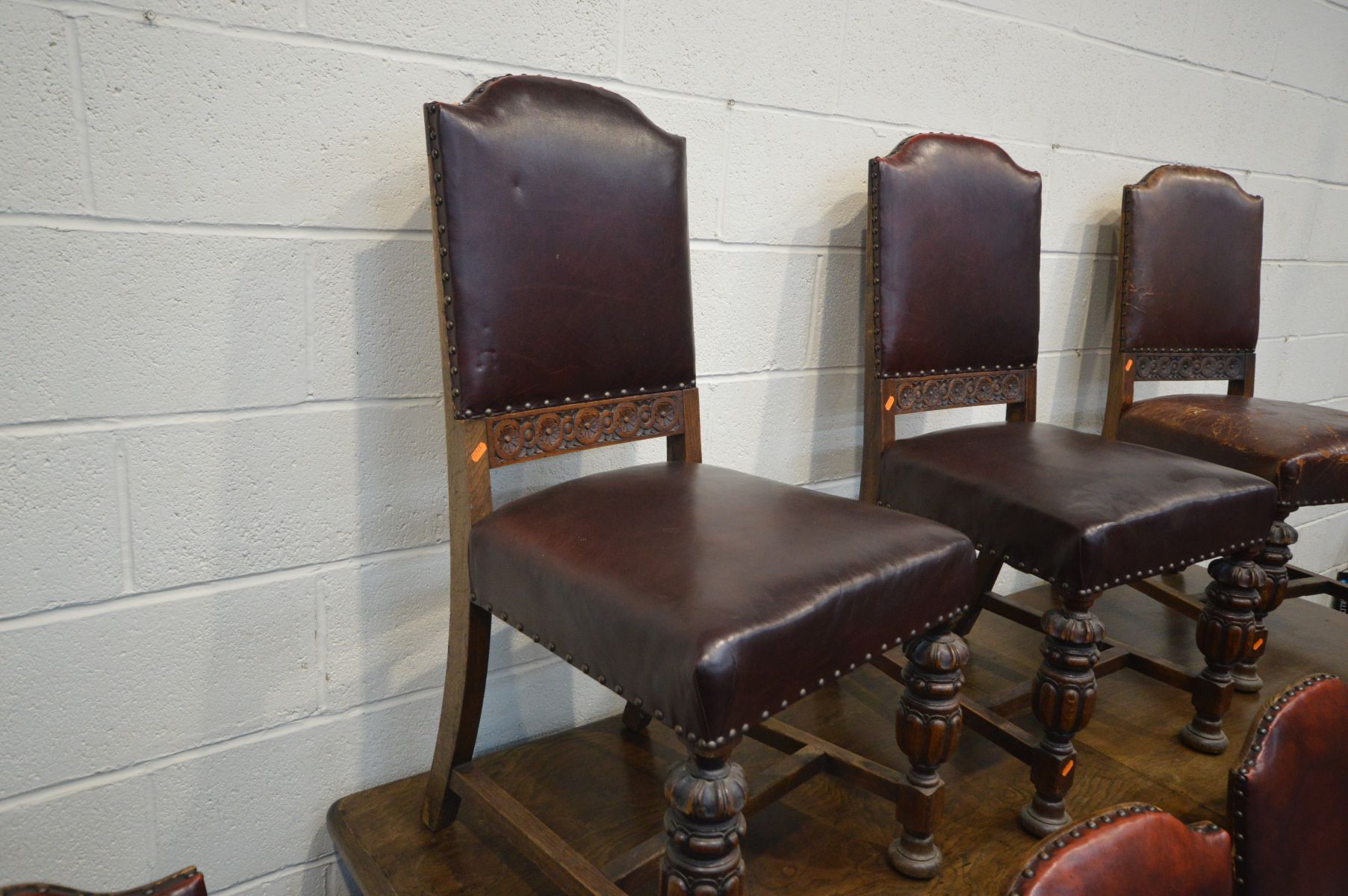 A SET OF EIGHT EARLY LATE 19TH/20TH CENTURY OAK AND OXBLOOD LEATHER STUDDED DINING CHAIRS, including - Image 3 of 6