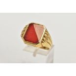 A GENT'S YELLOW METAL CARNELIAN SIGNET RING, rectangular shape with cut off corners, half set with a