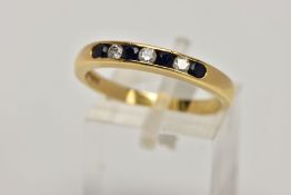AN 18CT GOLD SAPPHIRE AND DIAMOND HALF ETERNITY RING, designed with a row of channel set circular
