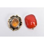 TWO YELLOW METAL BROOCHES, the first a carnelian cabochon brooch of a rounded rectangular form,