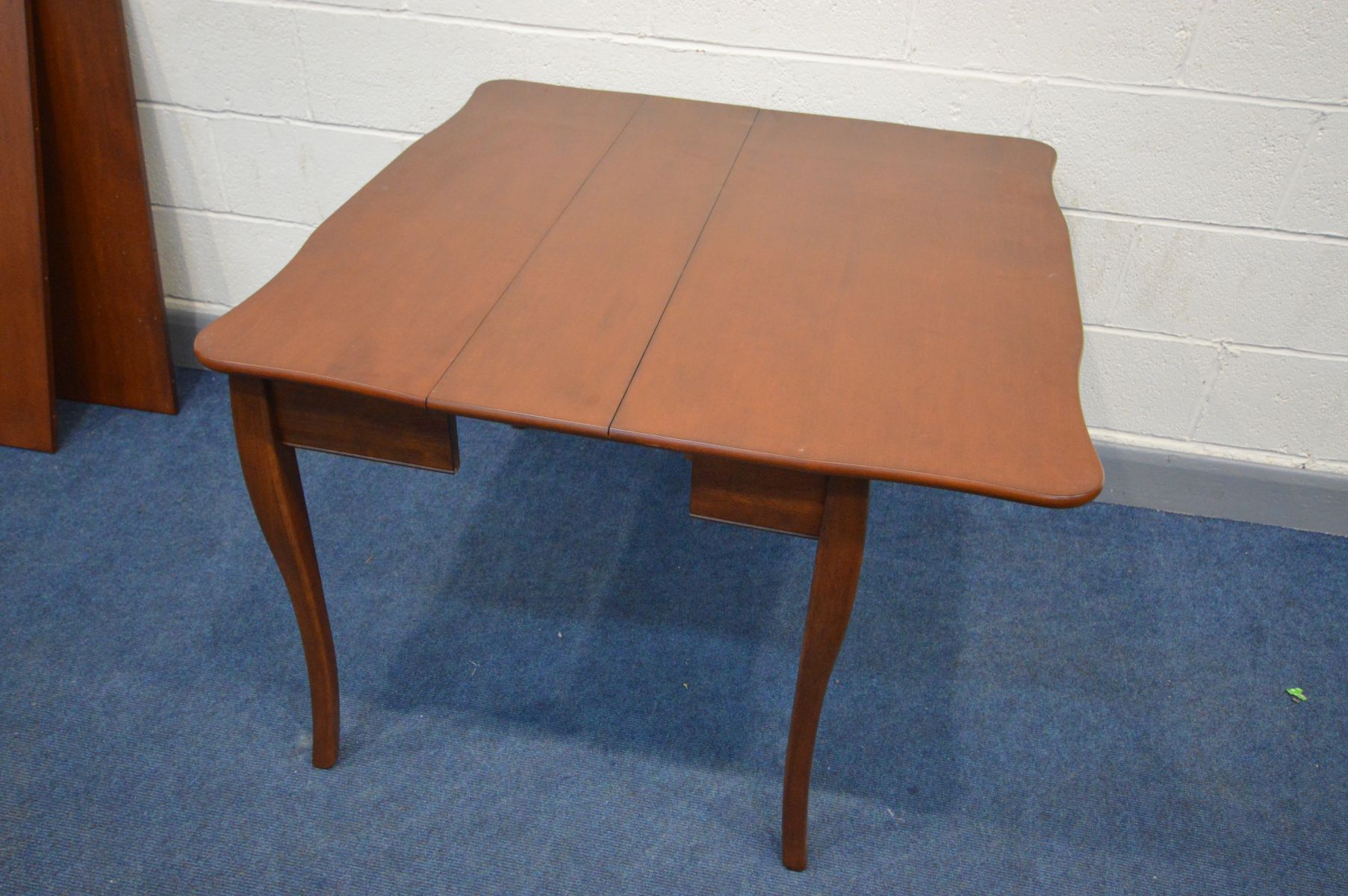 AN CHERRYWOOD EXTENDING DINING TABLE, that folds out from a tea table, with two additional leaves, - Image 3 of 4