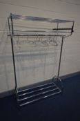 A CHROME CLOTHES RAIL with shelves and metal hangers, length 120cm x depth 50cm x height 176cm