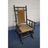 AN EARLY 20TH CENTURY BEECH CHILDS AMERICAN ROCKING CHAIR, height 71cm (condition - the rocking
