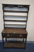 A OAK DRESSER, incorporating some Georgian timbers, with a double plate rack, and two drawers, width