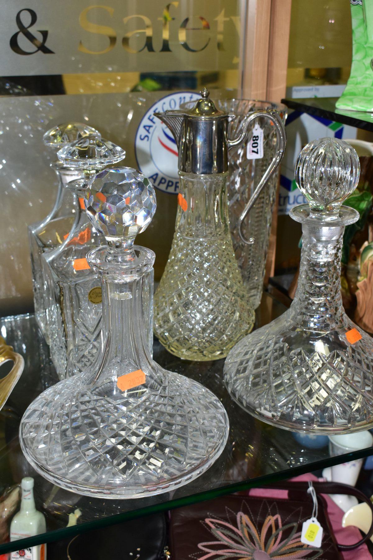 SIX PIECES OF GLASSWARE, comprising a pair of decanters with 'Cristal de France' label and stoppers,
