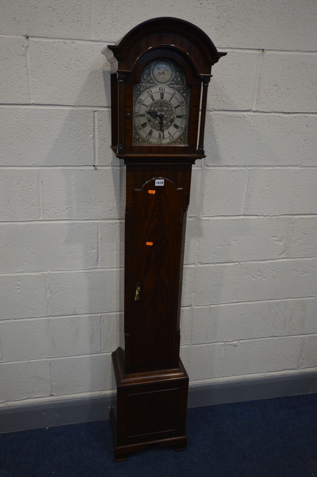 A MAHOGANY CHIMING GRANDDAUGHTER CLOCK, the silvered 6 inch dial with tempus fugit labelled to arch,