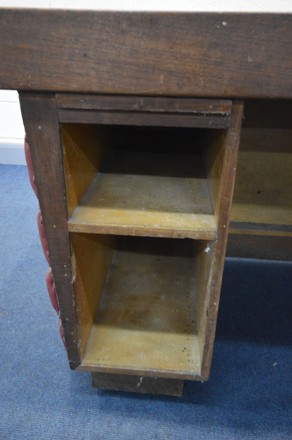 AN EARLY 20TH CENTURY OAK AND RED LEATHERETTE BUTTON SIDED KNEE HOLE DESK, with a bank of four - Image 2 of 7