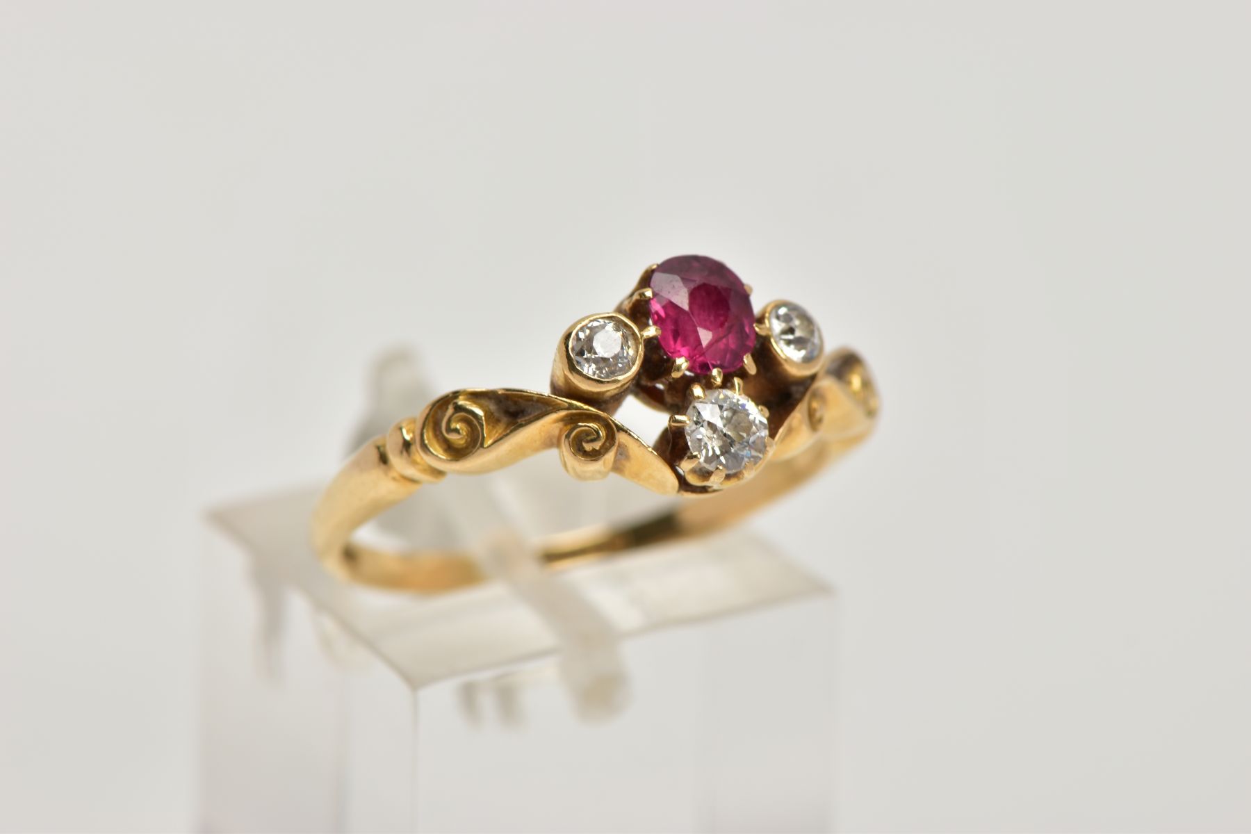 A YELLOW METAL RUBY AND DIAMOND DRESS RING, designed with a cushion cut ruby, flanked with old cut - Image 4 of 4