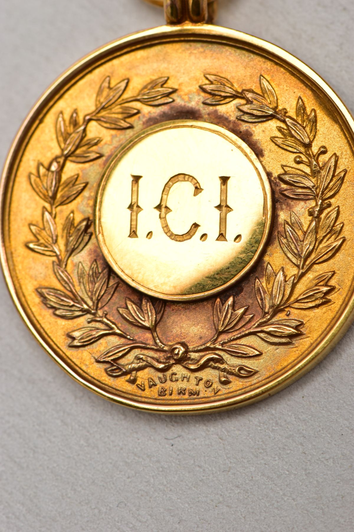 A 9CT GOLD FOB MEDAL, of a circular form, engraved to the front 'I.C.I' within a foliate wreath, - Image 2 of 5