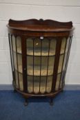 AN EARLY 20TH CENTURY MAHOGANY DEMI LUNE ASTRAGAL GLAZED CHINA CABINET, on ball and claw feet, width