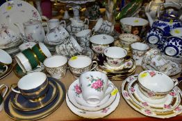 A COLLECTION OF CERAMIC TEAWARES to include six Coalport cups and saucers with green and gold bands,