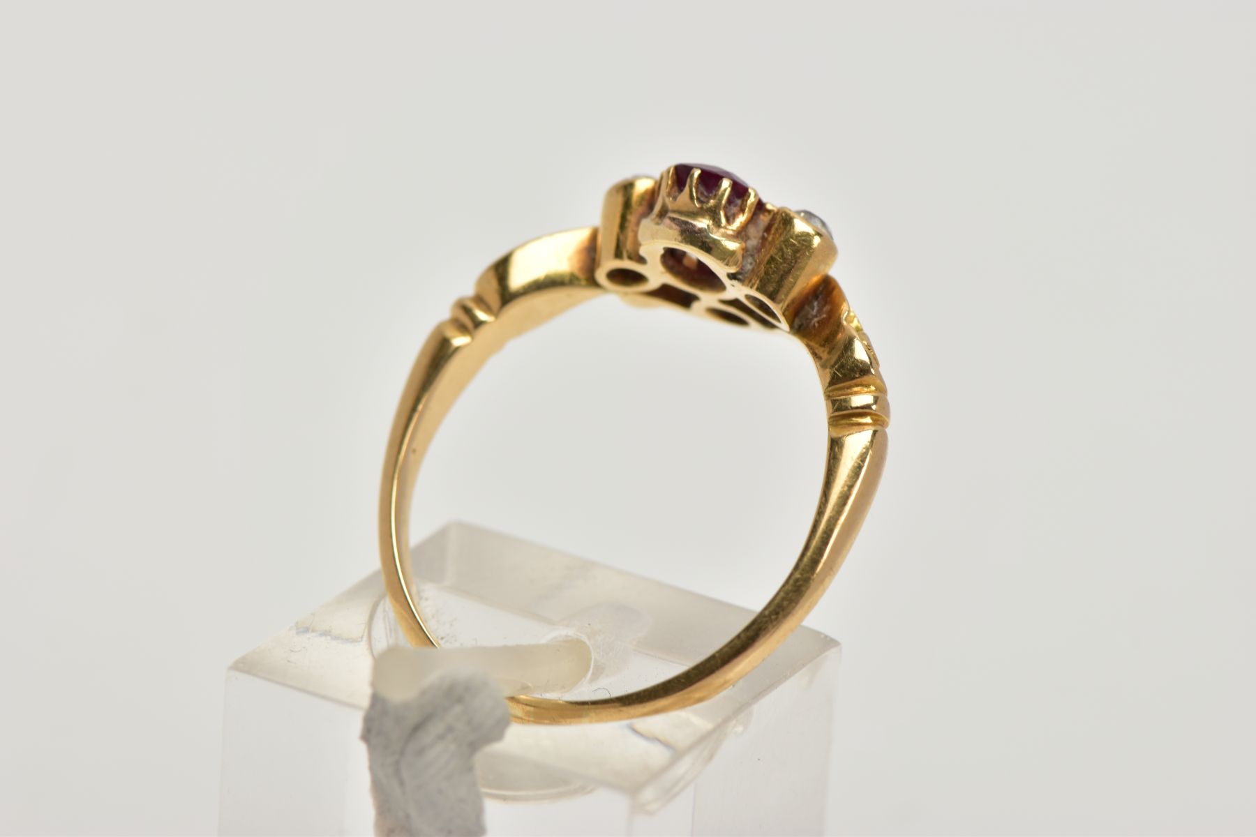 A YELLOW METAL RUBY AND DIAMOND DRESS RING, designed with a cushion cut ruby, flanked with old cut - Image 3 of 4