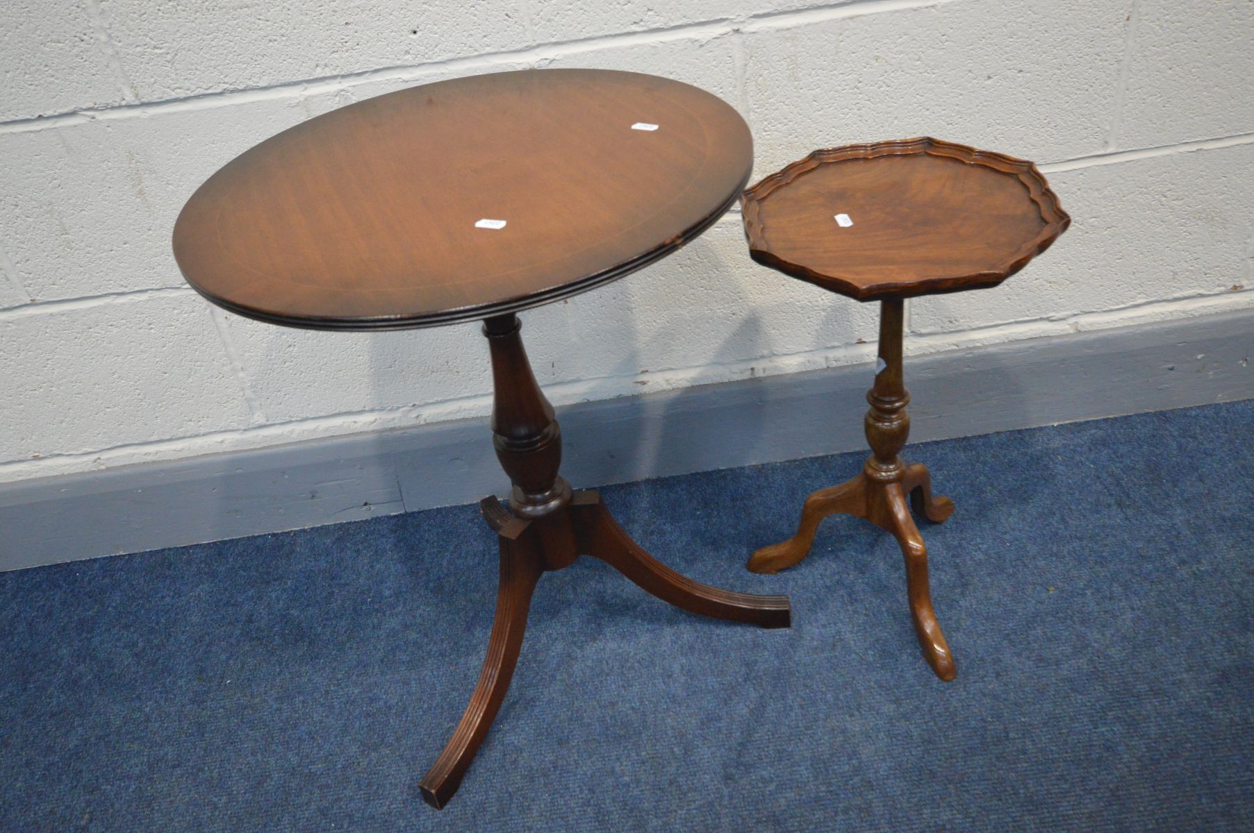 A REPRODUCTION MAHOGANY WINE TABLE, and a circular topped tripod table (2)
