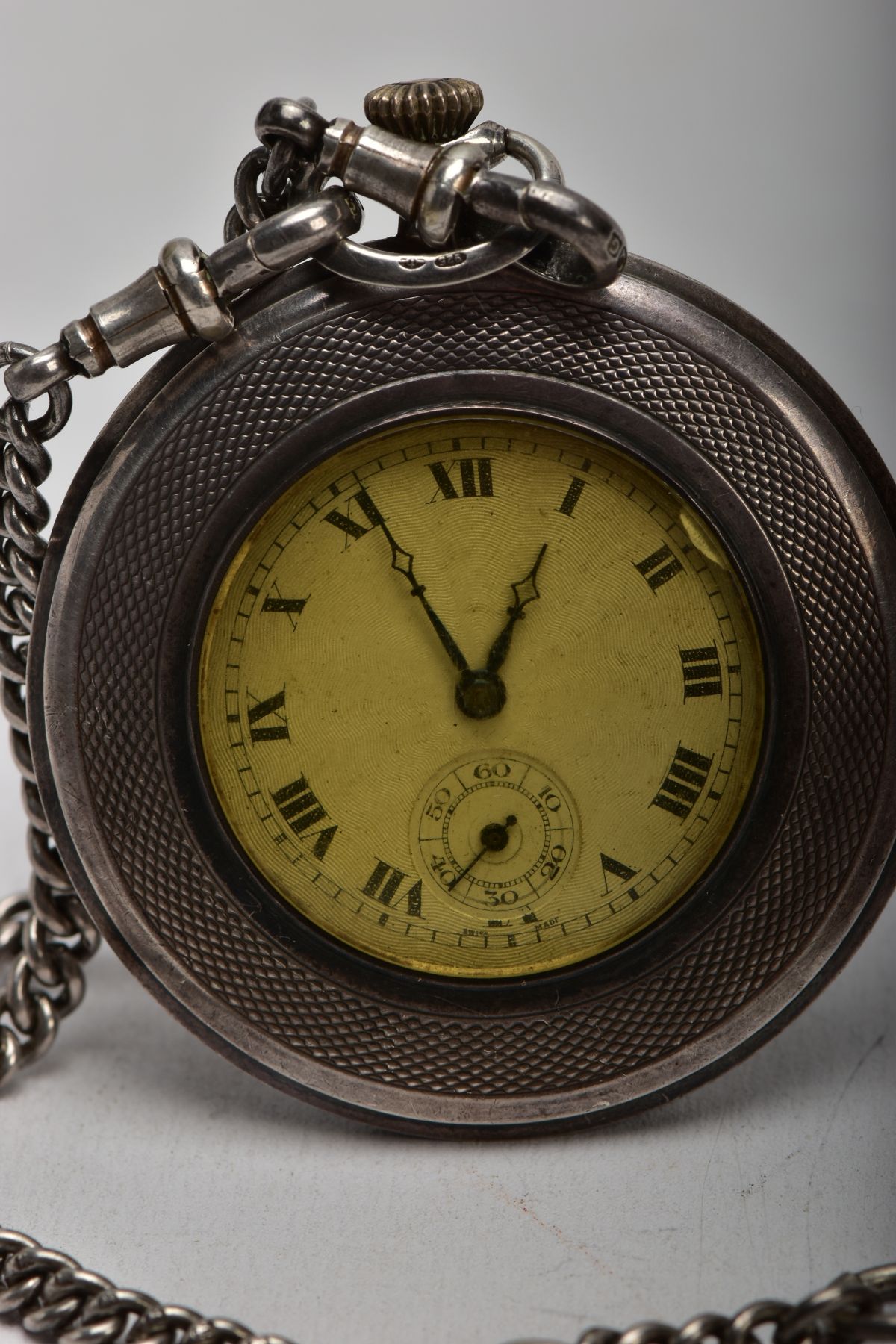 A SILVER OPEN FACE POCKET WATCH WITH AN ALBERT CHAIN AND A FOB MEDAL, round engine turned design - Image 2 of 7