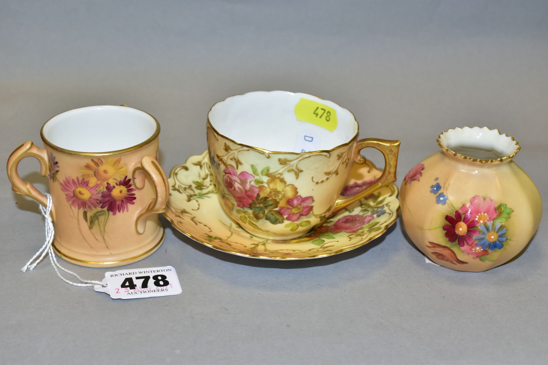 A ROYAL WORCESTER BLUSH IVORY MATCHED COFFEE CUP AND SAUCER AND TWO OTHER SIMILAR ITEMS, the cup and