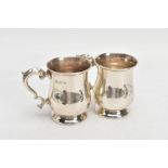 A PAIR OF SILVER TANKARDS, plain polished baluster form, scroll detailed handle with a leaf shaped