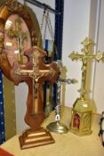 FIVE VARIOUS 20TH CENTURY WOODEN AND METAL CRUCIFIXES, three of table top form and two hanging,