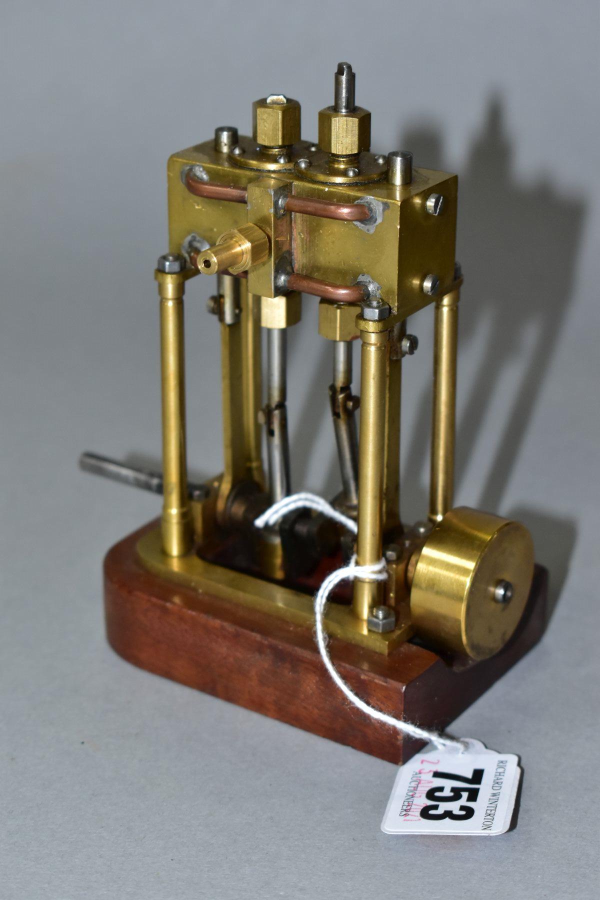 A VERTICAL TWIN CYLINDER LIVE STEAM MODEL OF A MARINE ENGINE, not tested, of brass and steel