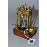 A VERTICAL TWIN CYLINDER LIVE STEAM MODEL OF A MARINE ENGINE, not tested, of brass and steel