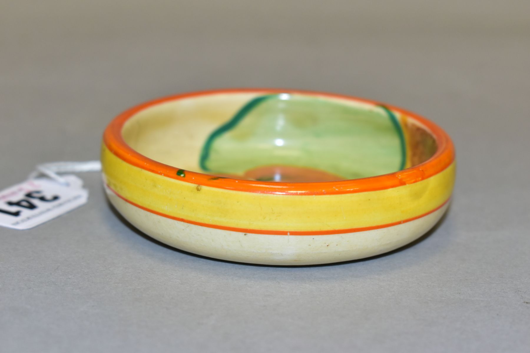 A CLARICE CLIFF BIZARRE 'NASTURTIUM' PATTERN PIN DISH, orange and yellow bands to the exterior, - Bild 2 aus 3