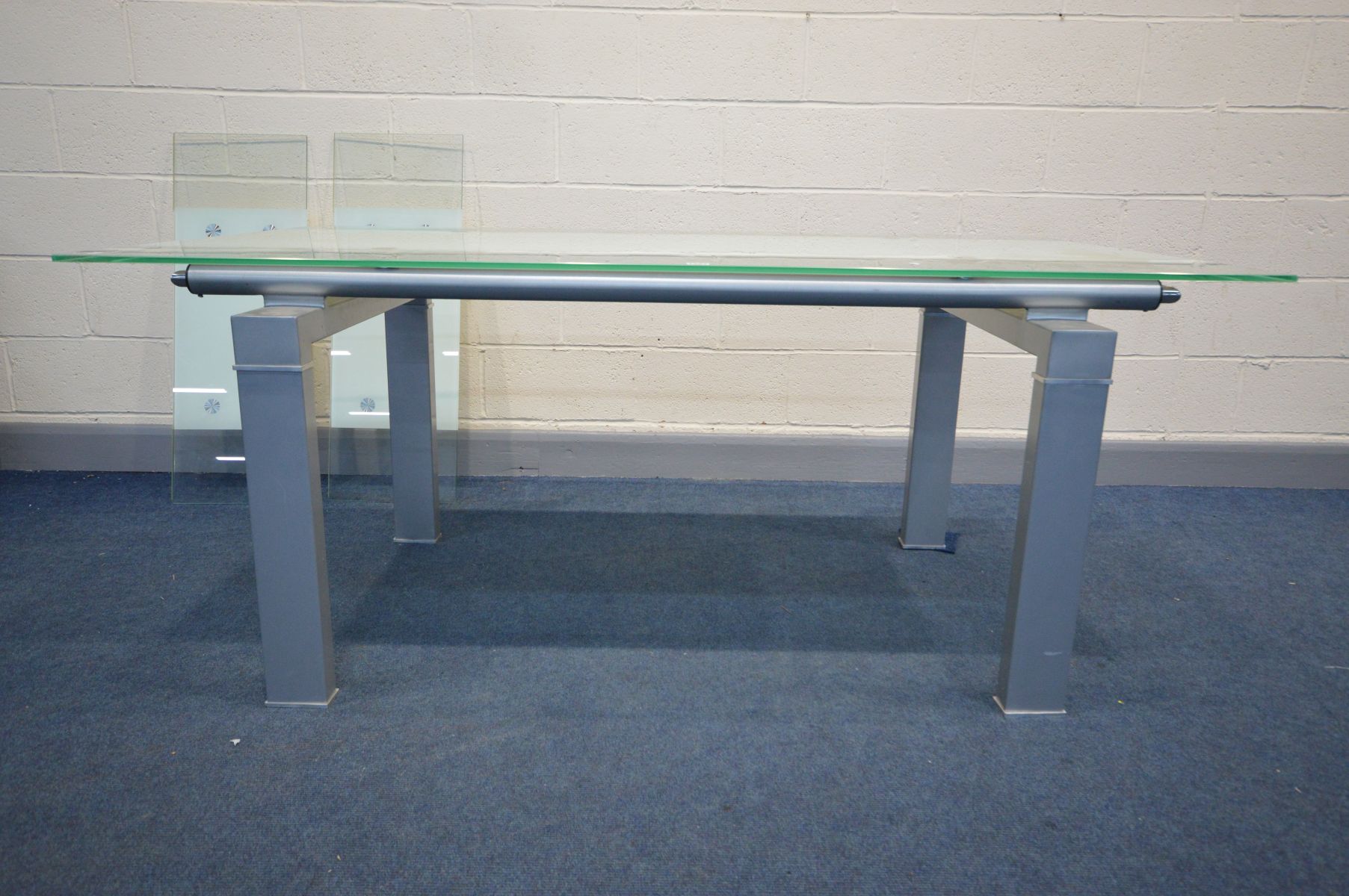 A MODERN GLASS TOP EXTENDING CONFERENCE/DINING ROOM TABLE, on a metal block frame, pull out leaf - Image 3 of 6