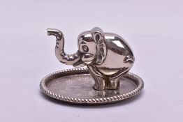 A MODERN SILVER PLATED NOVELTY RING HOLDER OF ELEPHANT FORM, mounted on an oval tray base, height