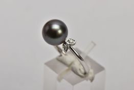 A 9CT WHITE GOLD CULTURED PEARL AND DIAMOND RING, designed with a single cultured black pearl, round