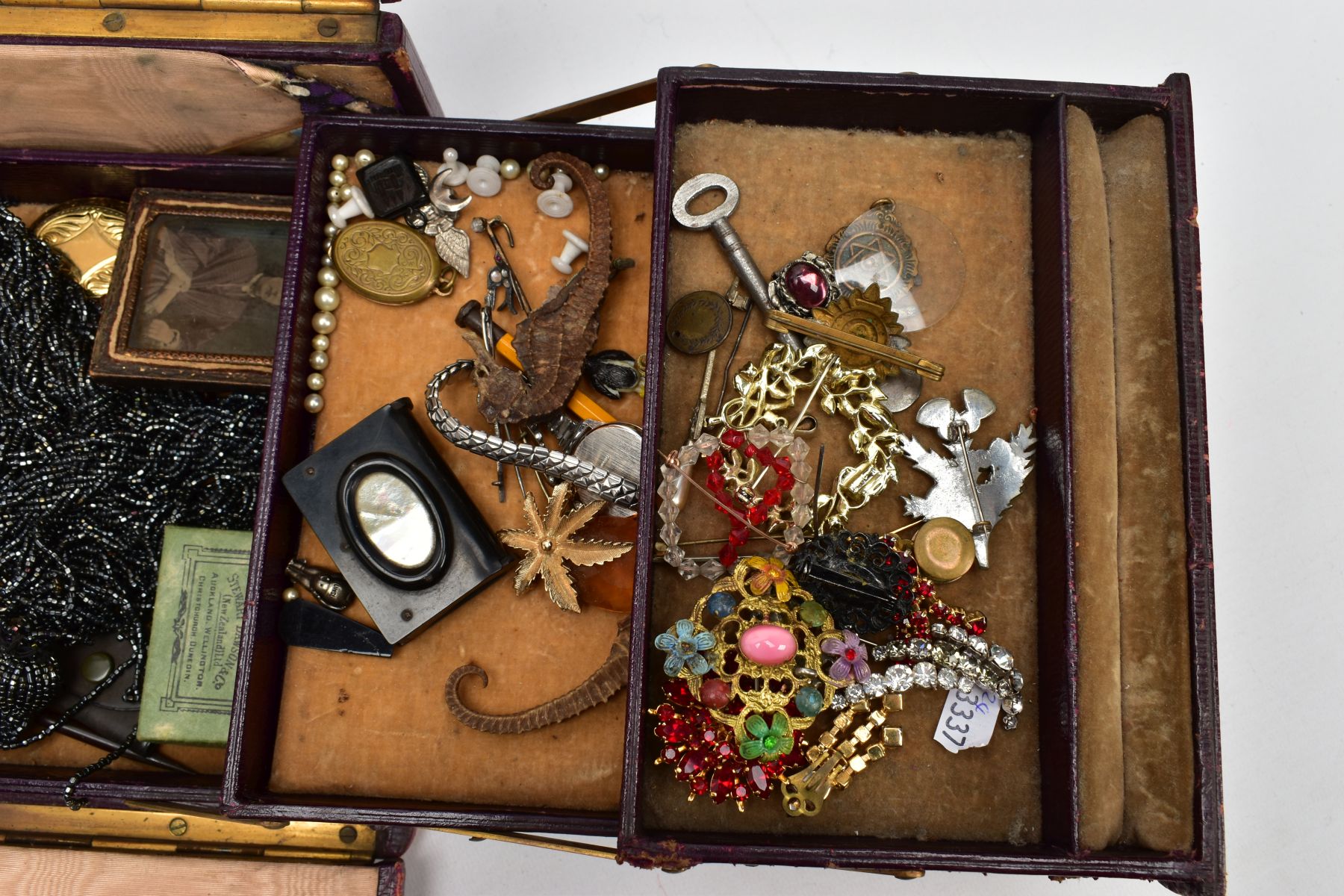 A HINGED BOX OF MAINLY COSTUME JEWELLERY, to include a jet book charm engraved with a church and - Image 2 of 9