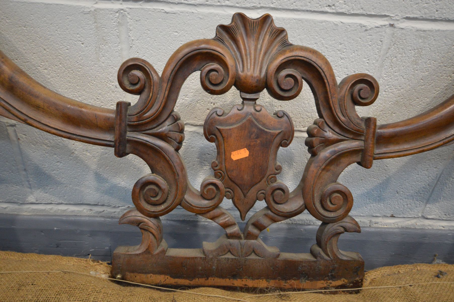 A VICTORIAN WALNUT OPEN DOUBLE BACK SOFA, the frame carved with foliate scrolls, shield centre - Image 4 of 13