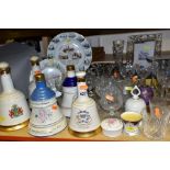 A MIXED GROUP OF CERAMICS AND GLASS, to include five ceramic Bells Whisky decanters (still