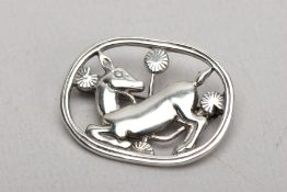 A WHITE METAL GEORG JENSEN STYLE BROOCH, depicting a deer amongst flowers, stamped to the reverse '