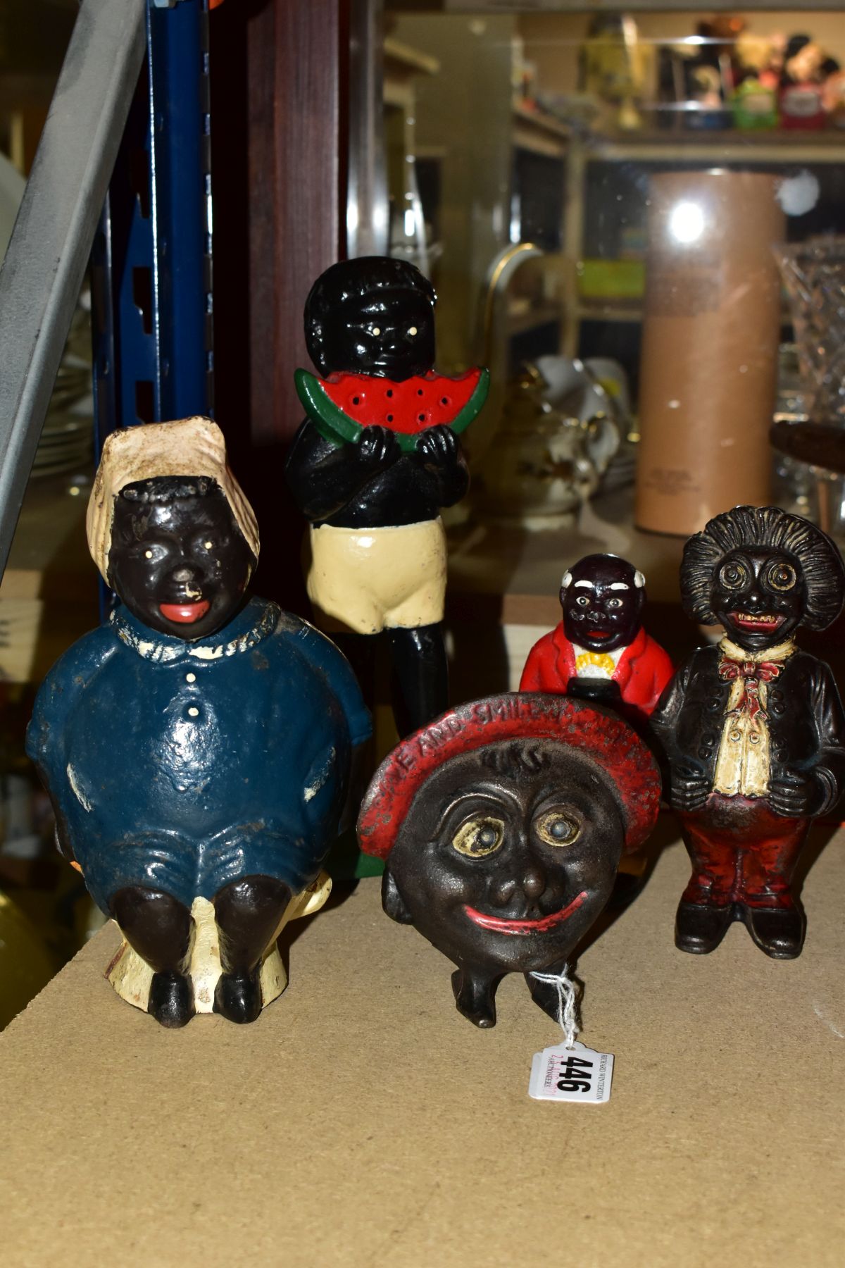 A QUANTITY OF CAST IRON MONEY BOXES/BANKS, assorted designs and colours to include 'Save & Smile