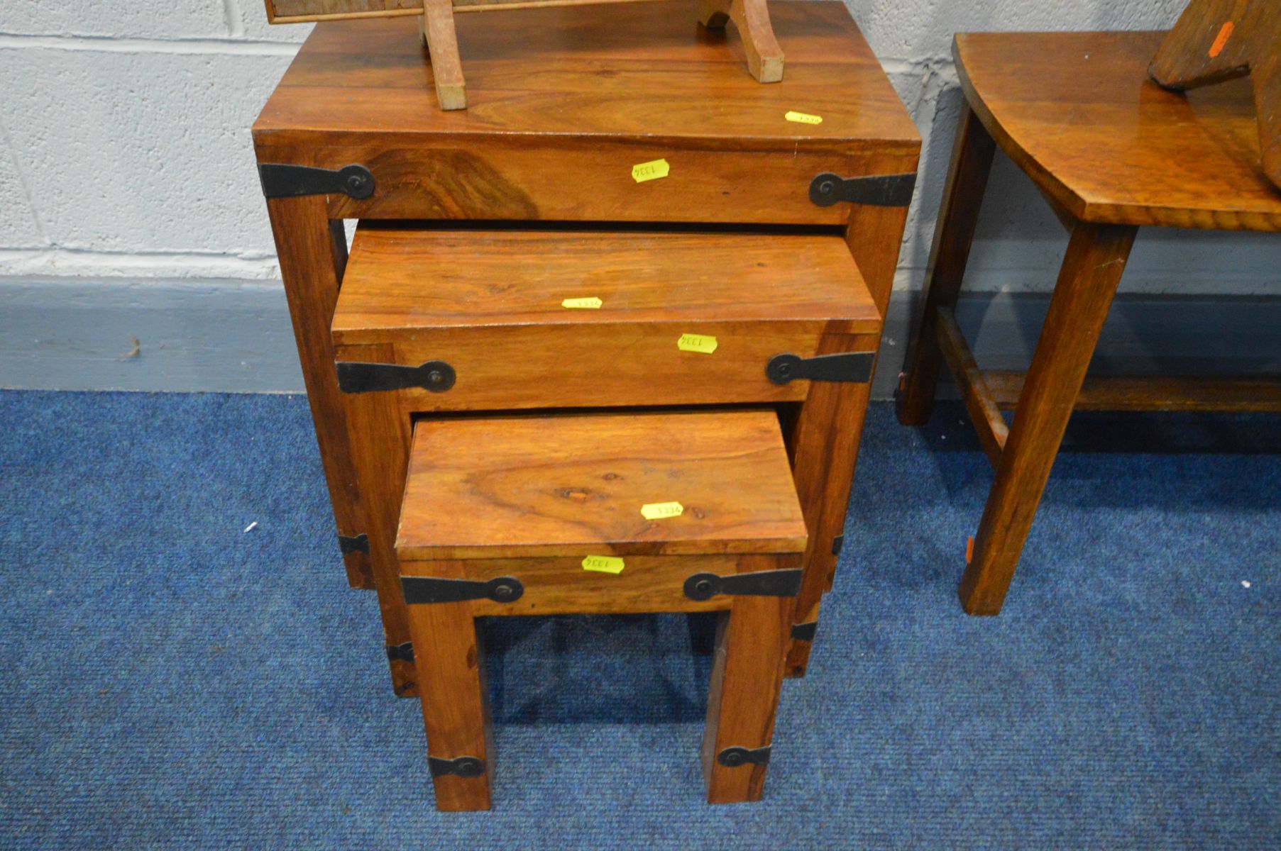 AN OAK COFFEE TABLE, an ash bench, hardwood nest of three tables and a fire screen (4) - Image 2 of 3