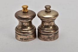 A PAIR OF SILVER SALT AND PEPPER MILLS, plain polished design, hallmarked 'Laurence R Watson & Co'