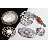 SIX WHITE METAL BROOCHES, to include an oval mother of pearl brooch within a marcasite surround,