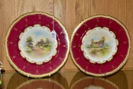 A PAIR OF ROYAL WORCESTER CABINET PLATES, pale yellow, claret and gilt ground border surrounding