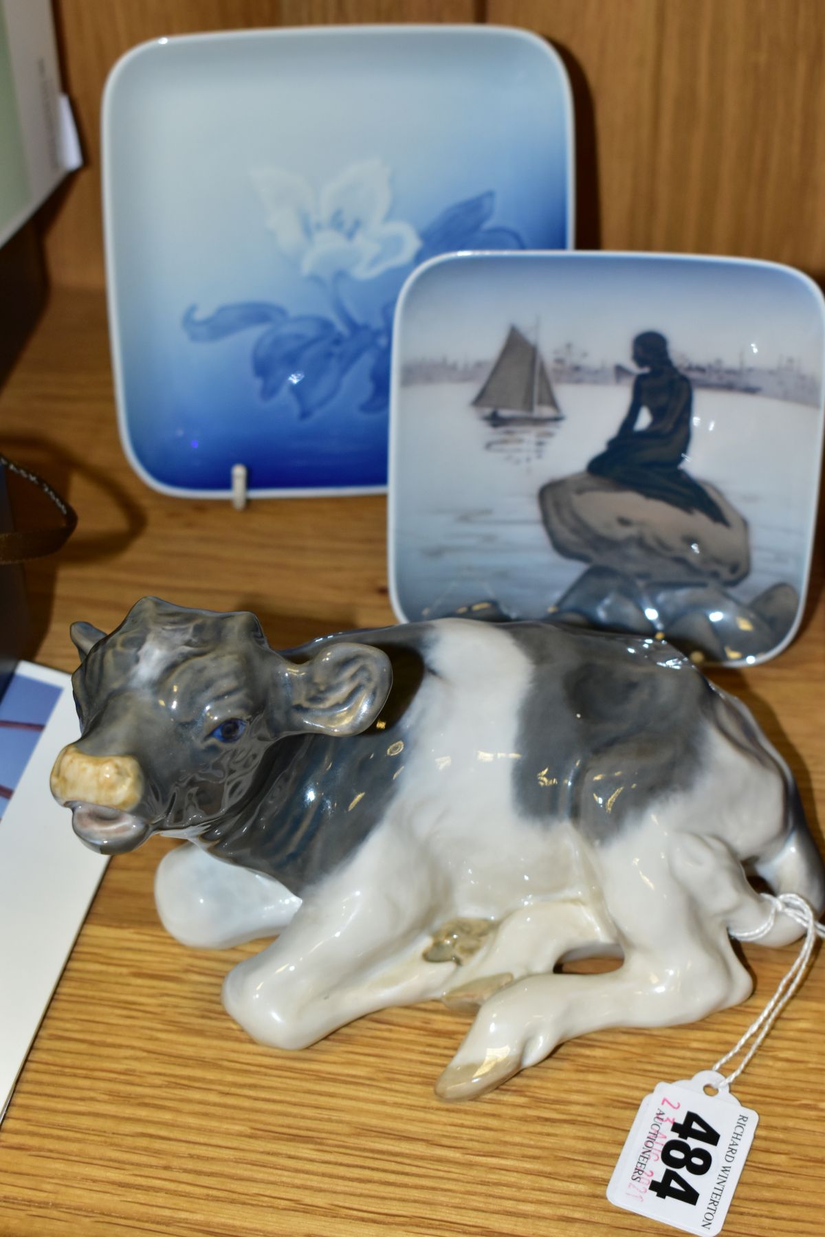 TWO PIECES OF ROYAL COPENHAGEN PORCELAIN AND ANOTHER SIMILAR, comprising 1072 Lying Calf, a pin dish