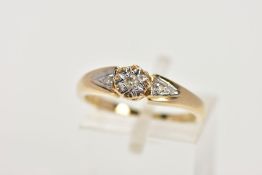 A 9CT GOLD DIAMOND RING, designed with an illusion set round brilliant cut diamond, flanked with