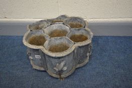 A PERIOD LEAD WAVY EDGED PLANTER with seven divisions, on claw feet, diameter 44cm x height 23cm (