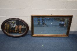 A GILT FRAMED WALL MIRROR, inscribed with 'WELCOME TO THE EATON LODGE' 116cm x 69cm and an oval