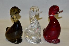 THREE WHITEFRIARS STYLISED DUCKS, all with controlled bubble inclusions, in flint, ruby and twilight