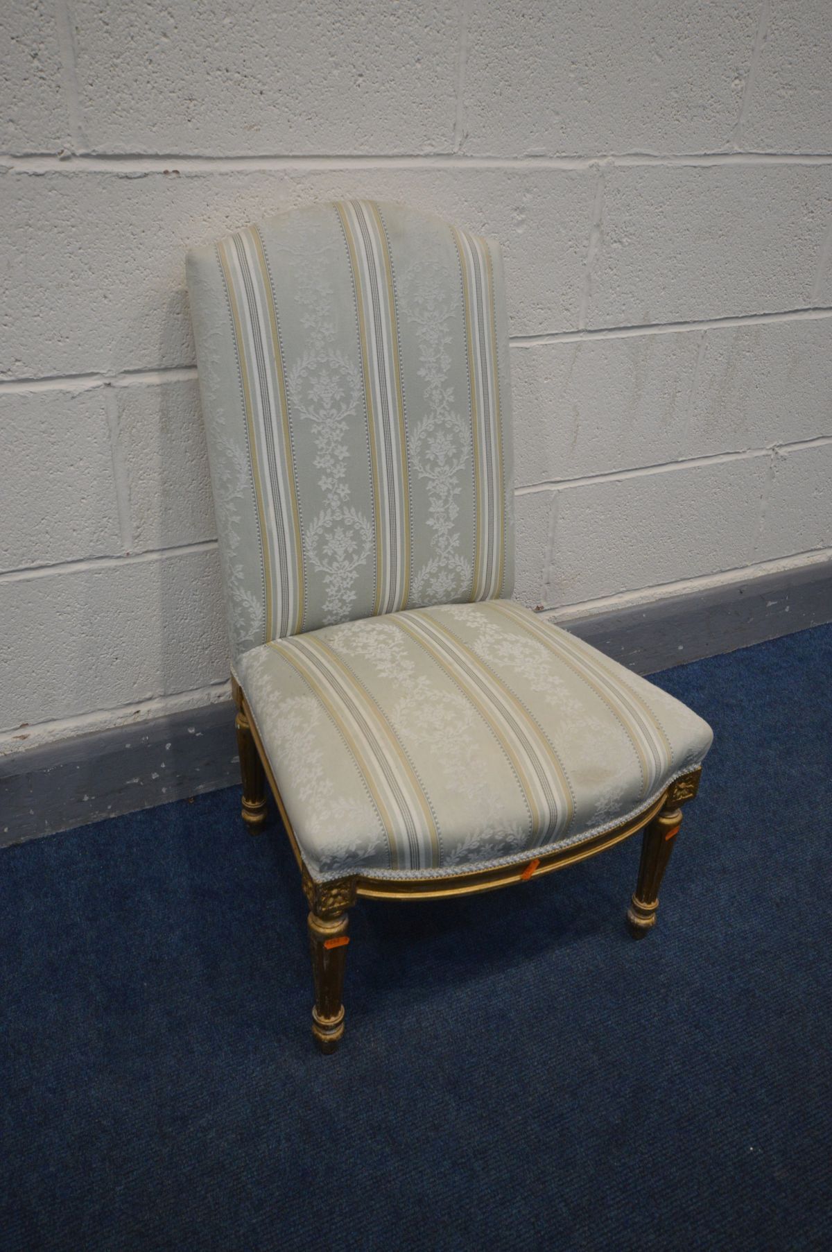 A 20TH CENTURY LOUIS XVI STYLE GILTWOOD BEDROOM CHAIR, on redded tapered legs, width 49cm x depth
