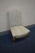 A 20TH CENTURY LOUIS XVI STYLE GILTWOOD BEDROOM CHAIR, on redded tapered legs, width 49cm x depth