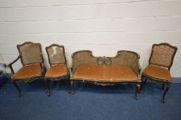 A LOUIS XVI STYLE EBONISED AND GILT FOUR PIECE SALON SUITE, with bergère backs, comprising a sofa,