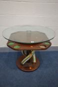 A BESPOKE HARDWOOD COFFEE/GAMES TABLE, with a circular glass top, on triple twist support base,