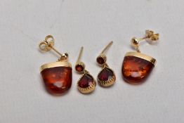 TWO PAIRS OF YELLOW METAL GEM SET EARRINGS, the first pair each suspending an amber cabochon, from a