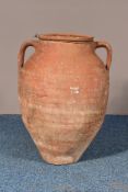 A MEDITERRANEAN TERRACOTTA BALUSTER SHAPED OLIVE POT, with twin handles, height 53cm
