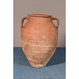 A MEDITERRANEAN TERRACOTTA BALUSTER SHAPED OLIVE POT, with twin handles, height 53cm