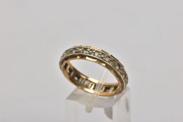 A 9CT GOLD FULL ETERNITY RING, set with circular cut colourless stones assessed as spinel,